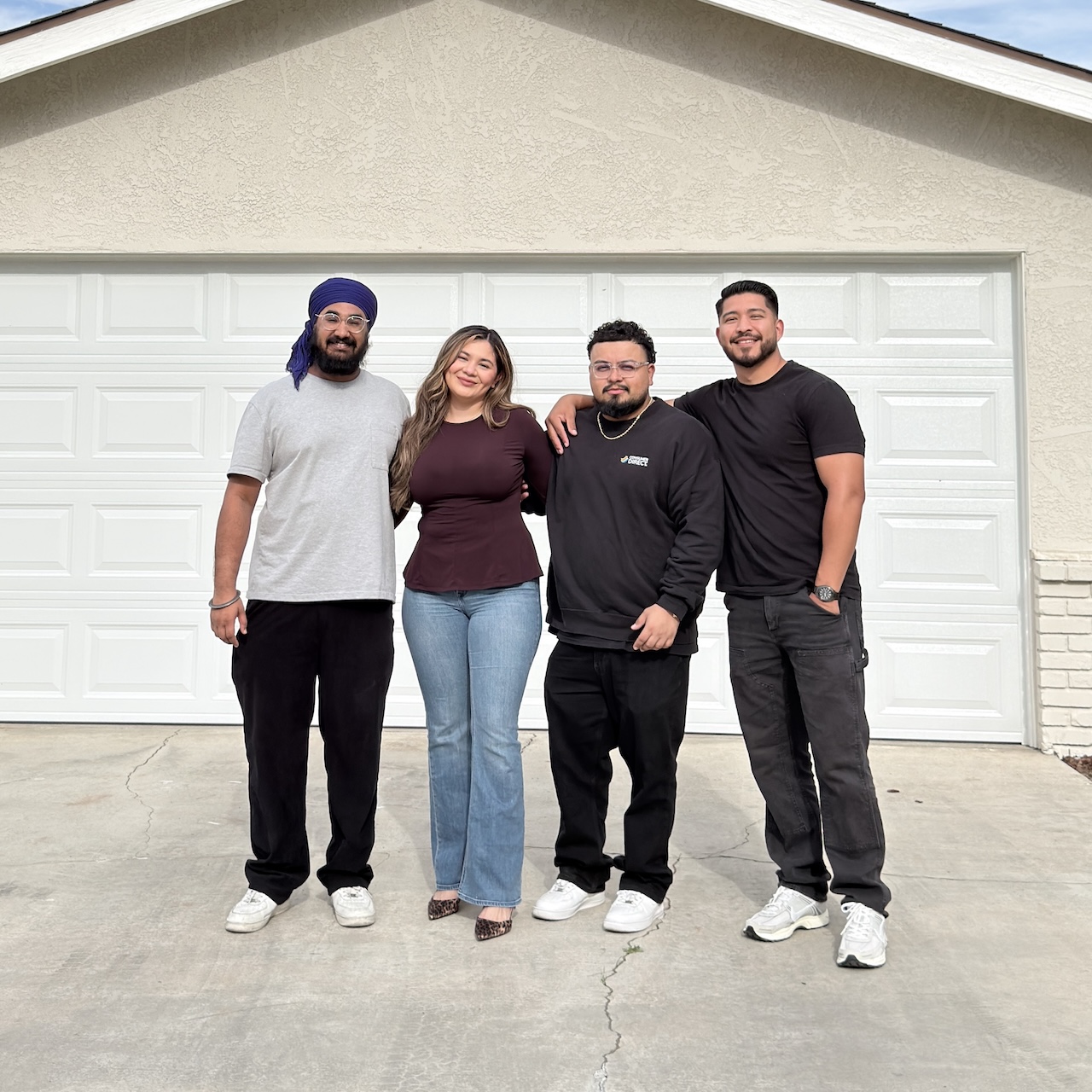 Mesa Group Capital team in front of client's new home