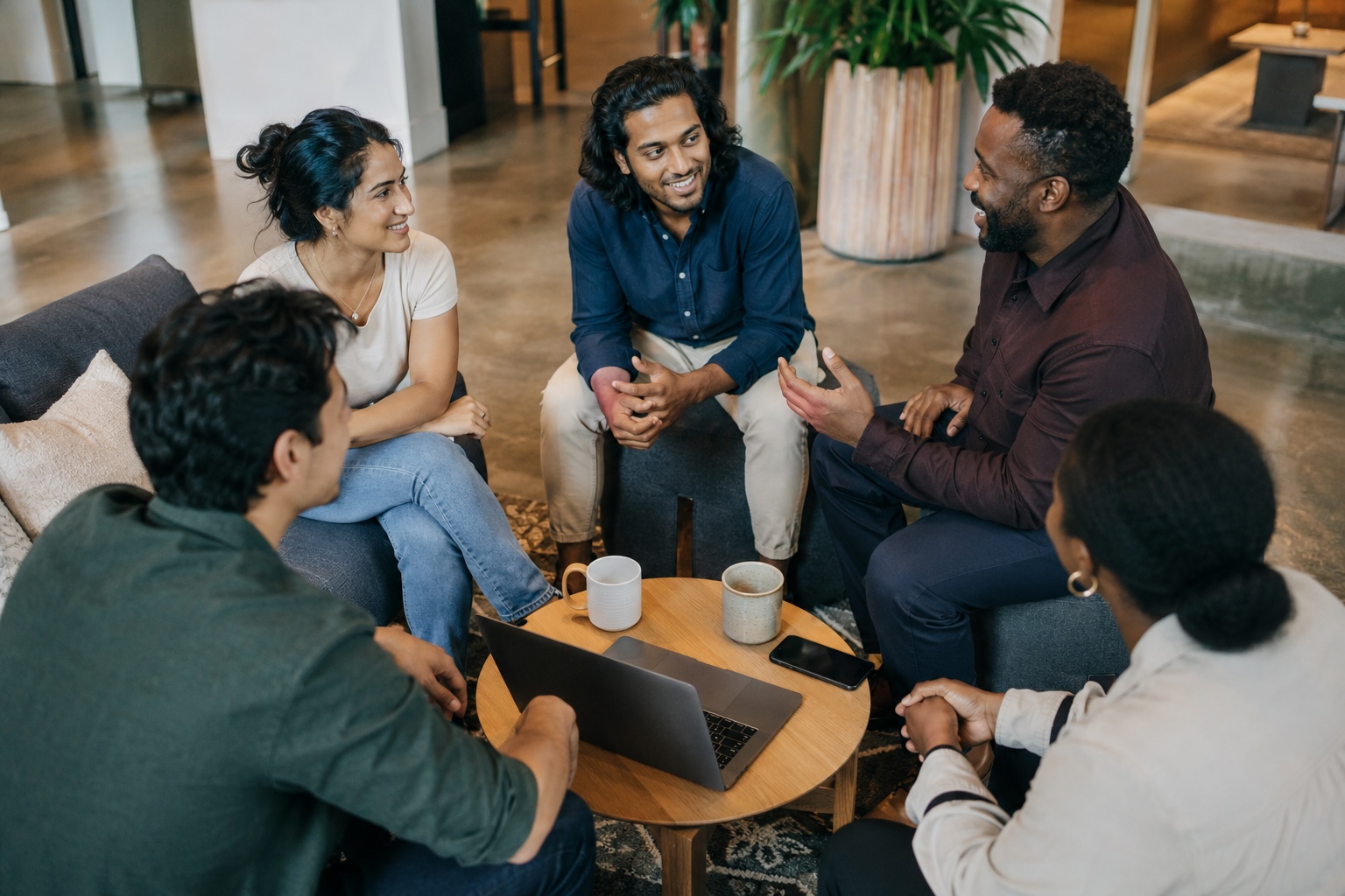 Diverse adults in a casual group conversation representing the Mesa Financial Concierge private community