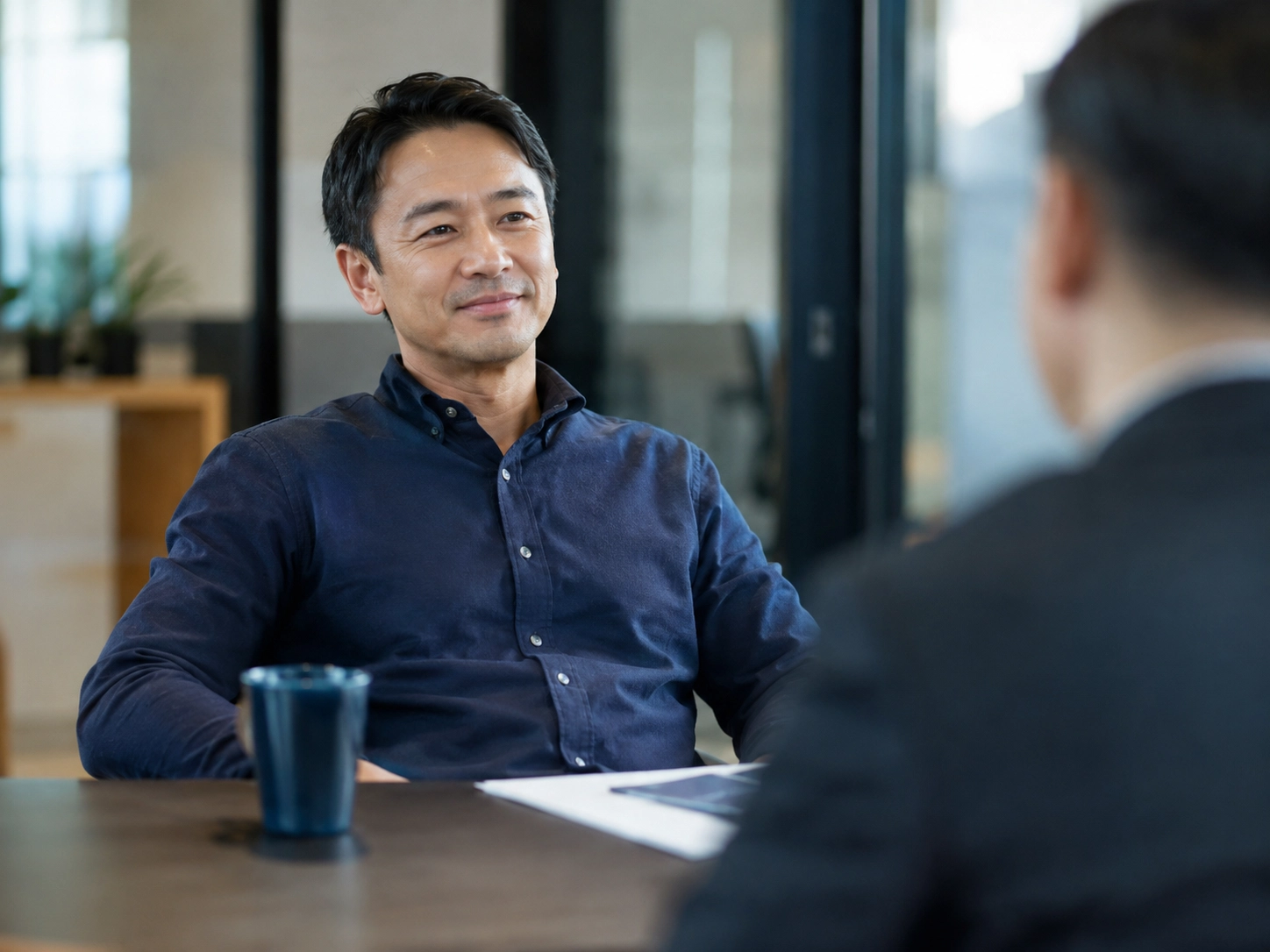 A business owner looking ahead to a stronger future after partnering with Mesa Group Consulting