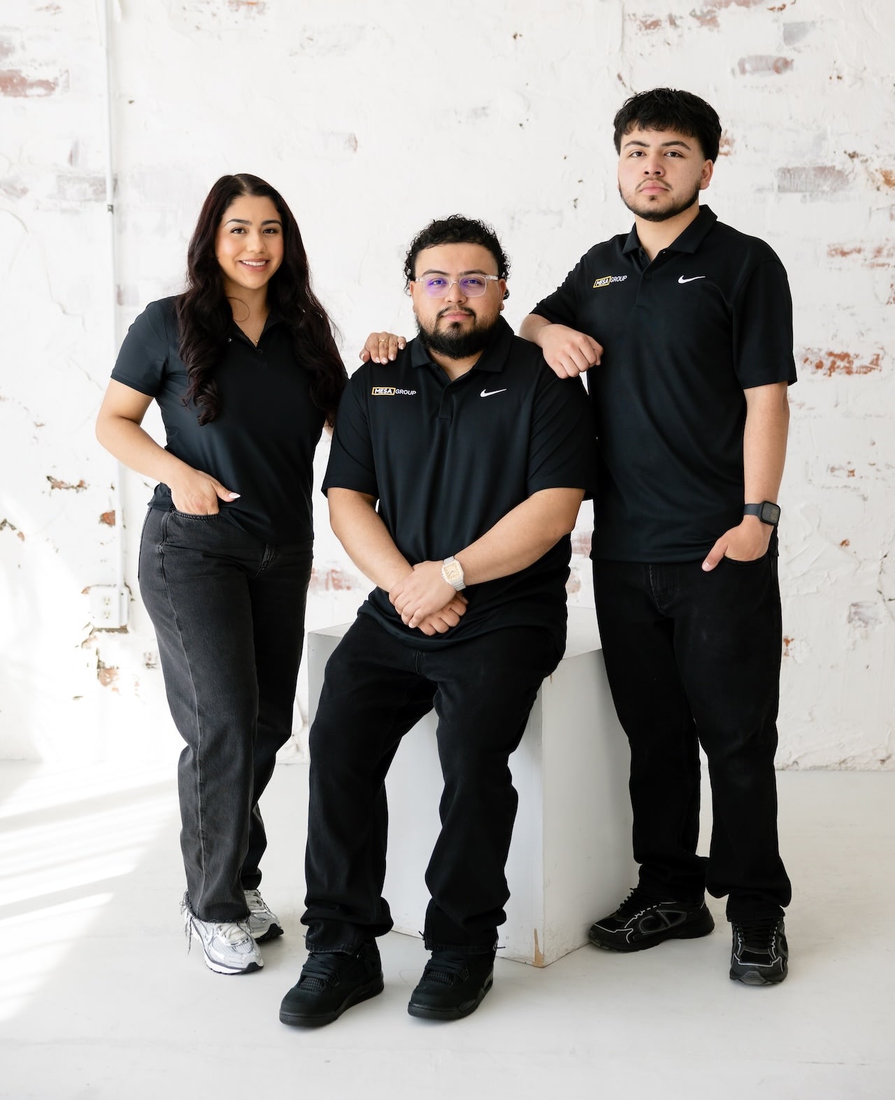 The Calderon family at Mesa Group Consulting — Aileen, Evert, and Justin Calderon in a professional full-body portrait